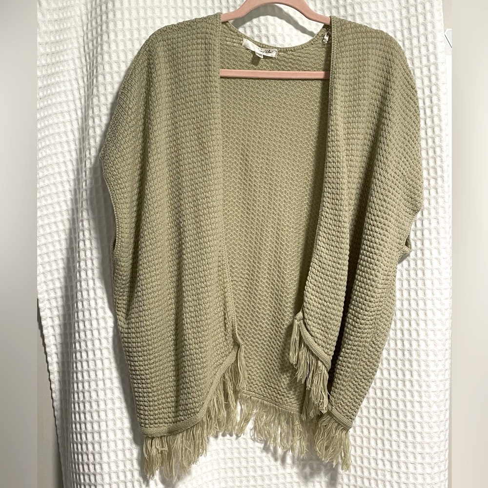 Light Tan Loose Fit Cardigan Fringe Along Bottom. One size.